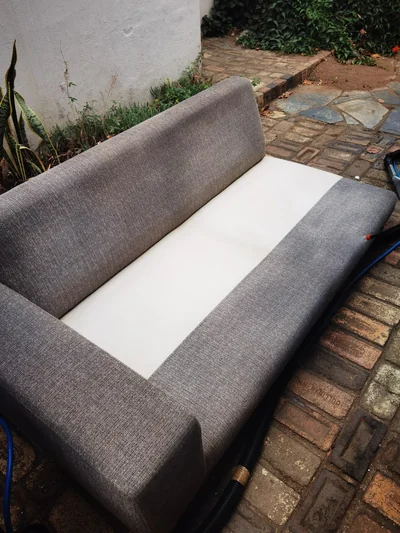 The same grey fabric couch after professional upholstery cleaning and extraction