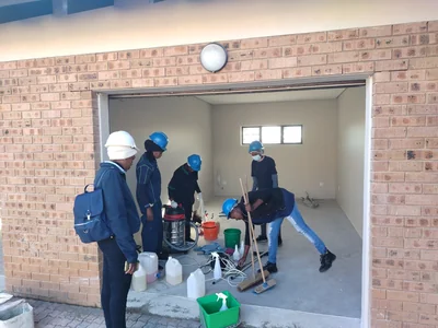 Cleaning team preparing equipment for a post construction clean at a new build