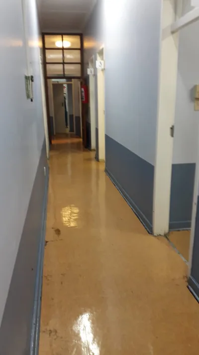 Corridor floors mid-clean after sewage flooding