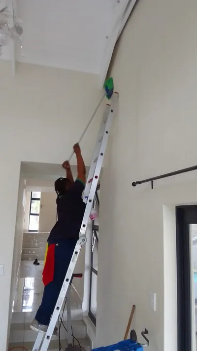 High-reach interior cleaning from ladders, done safely