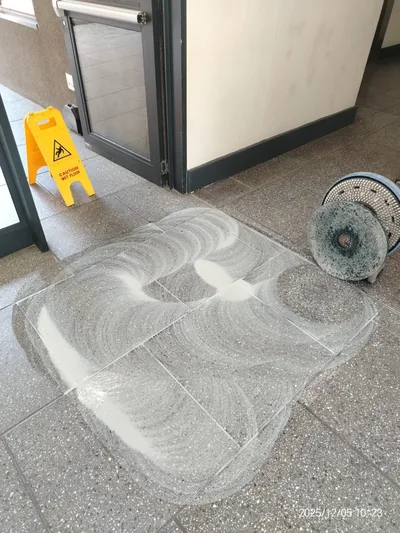 Machine-scrubbing years of build-up off hard floors