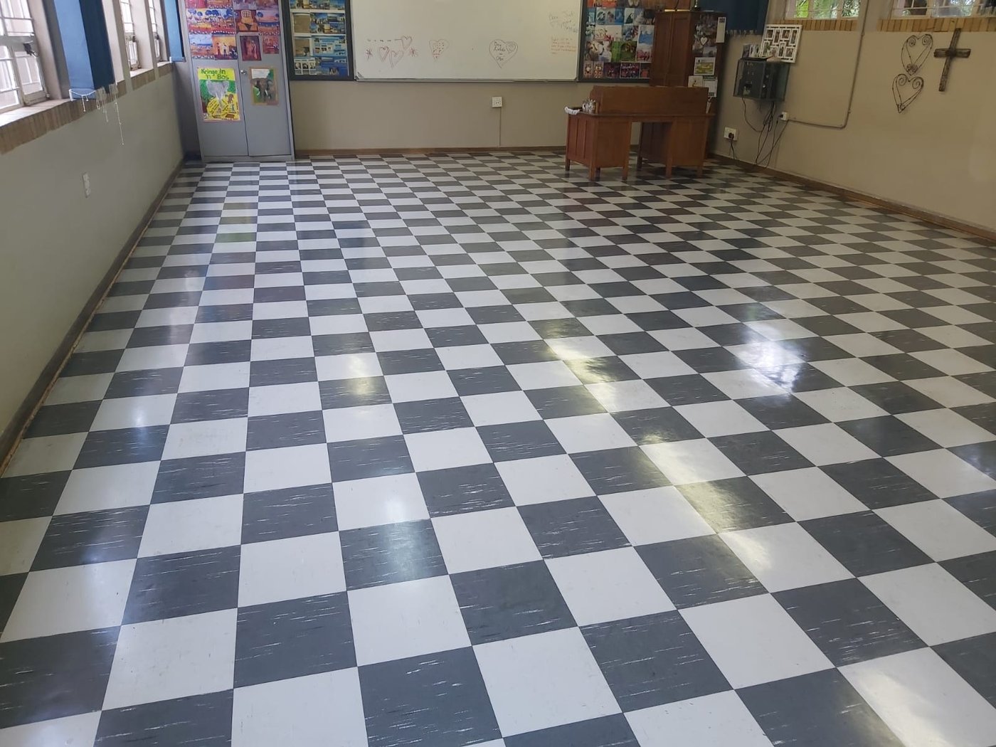Checkerboard floors polished in a community hall