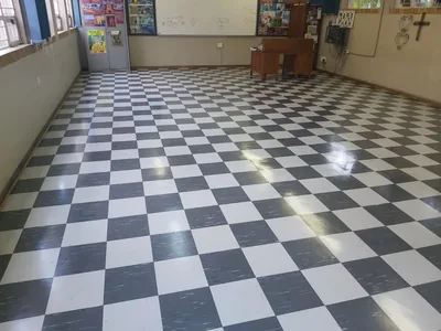 Checkerboard floors polished in a community hall
