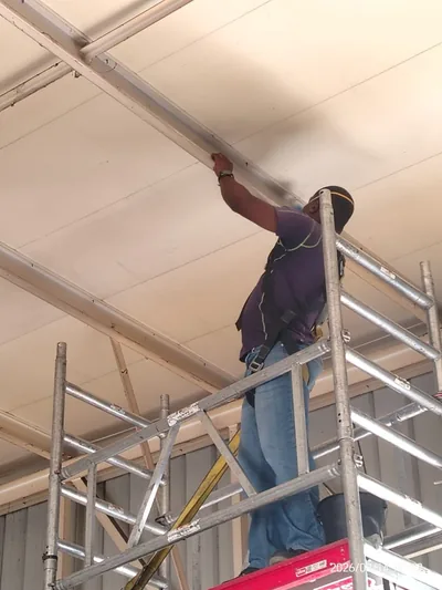 Ceiling panels cleaned from mobile scaffold