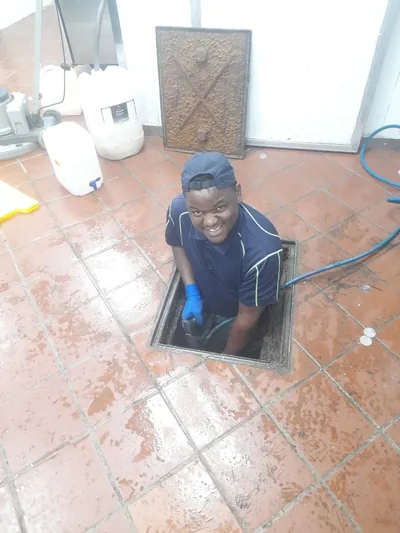 Grease trap and drain access, cleaned below floor level