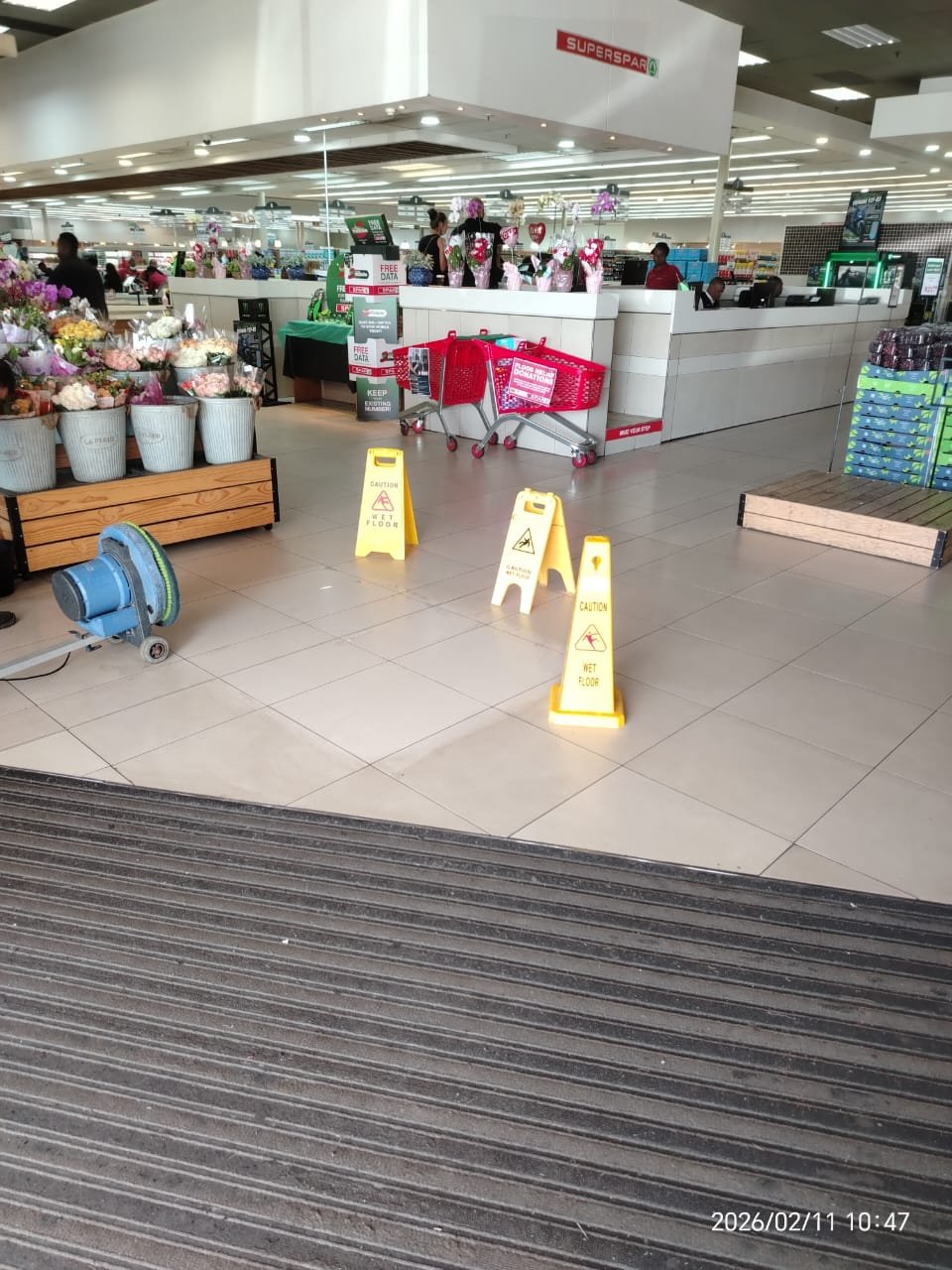 Supermarket entrance cleaned before opening