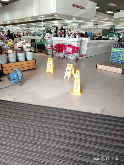 Supermarket entrance cleaned before opening